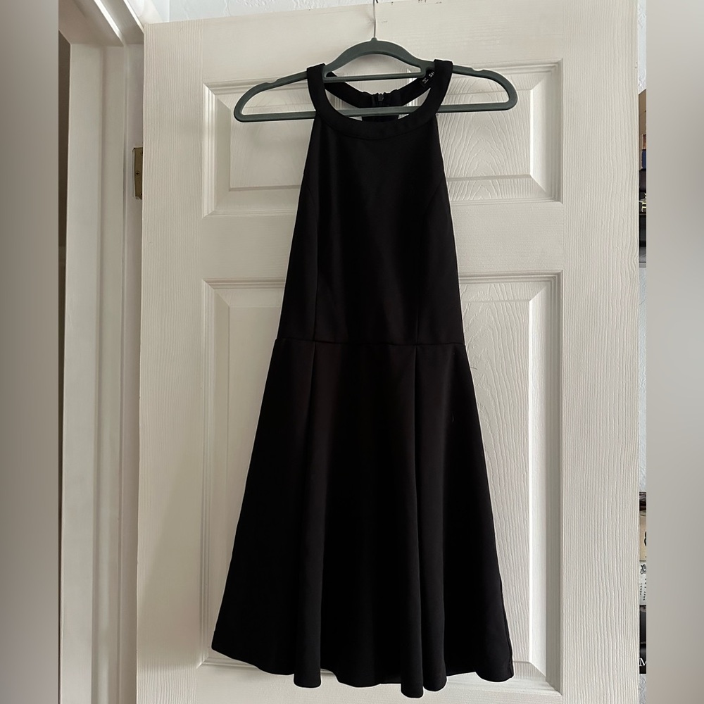 Black fit and flare dress with zipper and back details